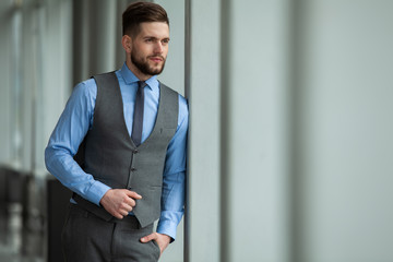 Portrait of a businessman looking at the window