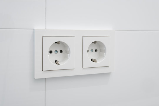 socket,  electric plug on white tiles