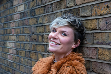 Portrait of young woman in furry coat