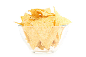 Potato chips in glass bowl isolated on white background