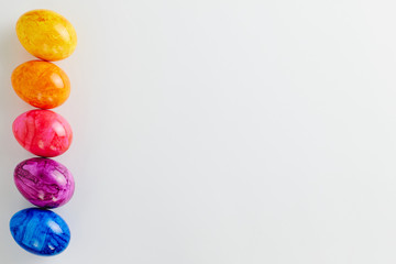 Colored Easter eggs on white background.