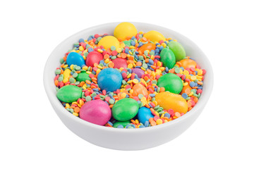 bowl filled with delicious multicolored candy isolated on white background