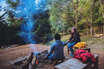 Couple travel photograph nature on the mountains relax in the holiday. Romance lovers Camp Fire winter