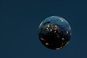 dead burning planet on a dark blue background