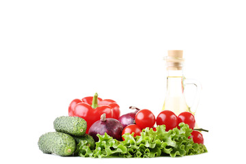 Fresh vegetables and oil in bottle isolated on white background