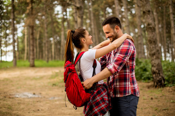 Fototapeta premium Loving coulpe having fun in the forest at spring time