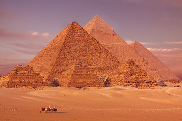 Fototapeta na wymiar pyramids of giza cairo in egypt with camel caravane