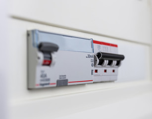 Automatic circuit breakers in a fuse box. Power control panel.