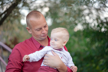 Fototapeta premium Father playing with little son on nature. Happy family concept