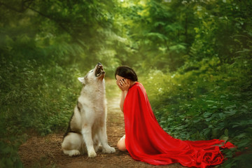story of a red cap with a scarlet long flying fluttering cloak, a dark-haired girl covers her face...