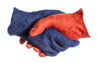 handshake of blue and orange gloves isolated