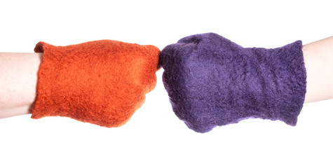 Fototapeta premium above view of fist bump of hands in color gloves