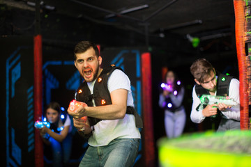 Emotional guy playing laser tag