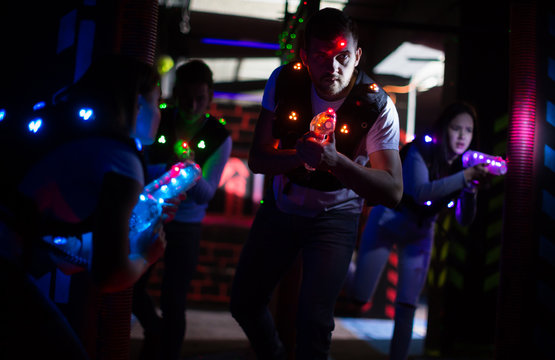 Young man on laser tag arena