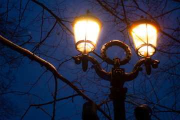 Street lamp against a dark blue sky