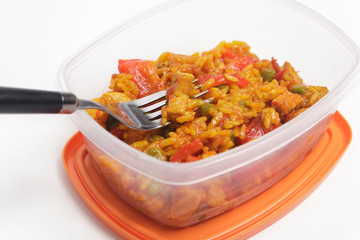 Paella in a plastic container ready to eat