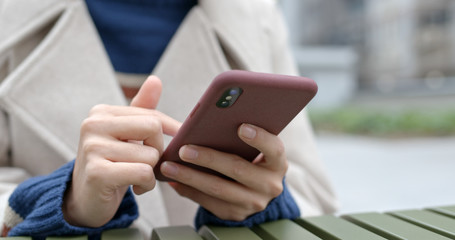 Woman holding mobile phone device