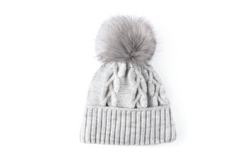 Gray winter knitted hat with boom isolated on white background.