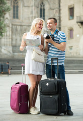 couple travellers holding map