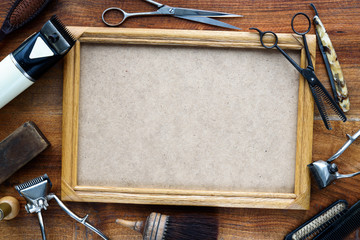 Old vintage barbershop tools on wooden table - barbershop background with copy-space