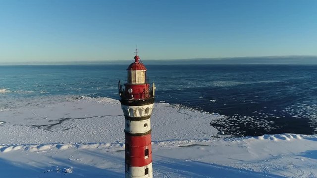 Lighthouse in winter. Aerial video shooting