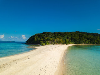 Aerial view of tropical  beach on island Ditaytayan. Beautiful tropical island with white sandy beach, palm trees and green hills. Travel tropical concept. Palawan, Philippines