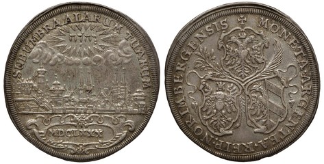 Germany German City of Nuremberg silver coin 1 one thaler 1680, riverbank with numerous churches, buildings and towers, tetragrammaton above clouds at top, three shields separated by branches,