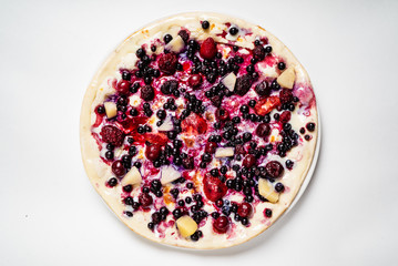 pizza with berries and fruits on the white background