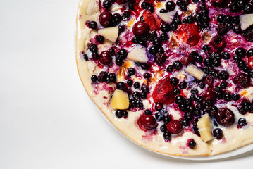 pizza with berries and fruits on the white background