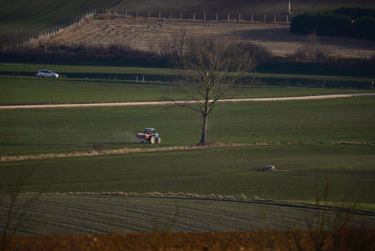 tractors sowing and working fields in the province of alava (the Basque country)