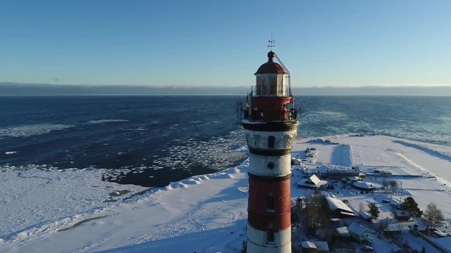 Lighthouse in winter. Aerial video shooting