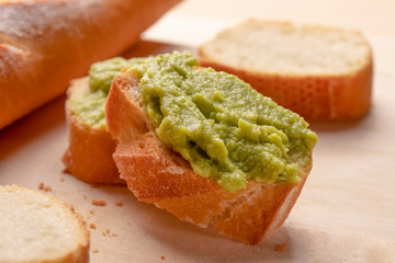 Fresh crunchy avocado cream sandwiches on sliced board