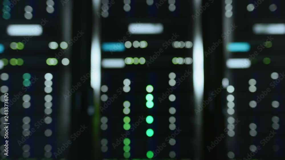 Fototapete Camera Super Zoom Shot of a Working Data Center With Rows of Rack Servers. Led Lights Blinking and Computers are Working.