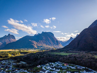 Drone Photo of the City Åndalsnes in Norway on Sunny Summer Day with Mountains, Fjord and Port in the Background