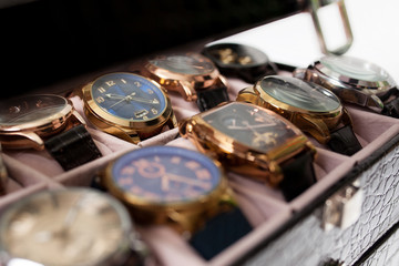 storage box with collection of men wrist watches