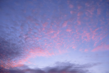 blue sky with sunrise clouds