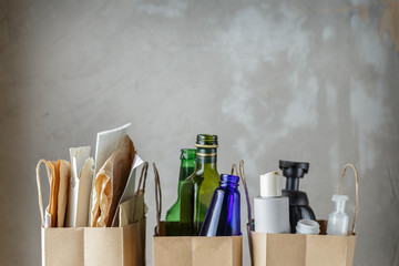 Three paper bags with sorted household waste