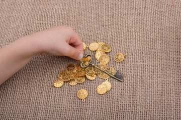 Hand holding a retro styled gold color key