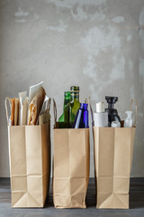 Three paper bags with sorted household waste