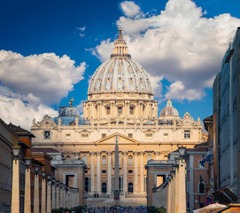 Fototapeta na wymiar View of dome St. Peter's and Vatican in Rome at sunny day in summer. The Vatican is the most prominent state in the world.