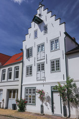 traditional gable roof house facade in the beautiful dutchman village Friedrichstadt in Schleswig...
