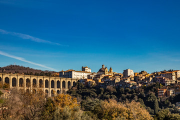 Fototapeta premium View of Ariccia, with the monumental bridge, the baroque Chigi palace and the church of Santa Maria Assunta by Gian Lorenzo Bernini. Castelli Romani, Lazio, Italy.
