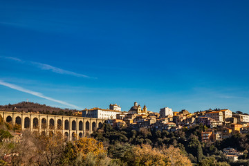 Fototapeta premium View of Ariccia, with the monumental bridge, the baroque Chigi palace and the church of Santa Maria Assunta by Gian Lorenzo Bernini. Castelli Romani, Lazio, Italy.