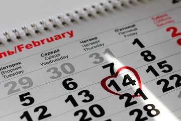 Calendar with the date of  February 14 Valentine's day with red heart mark