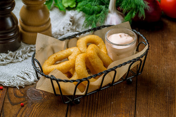 Rings of squid in batter with sauce