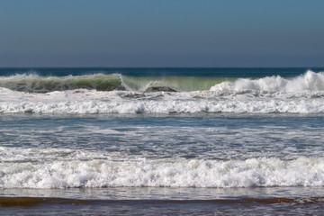 Atlantic Ocean waves rolling in and breaking on the sand beach at Agadir, Morocco, Africa