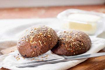 Homemade rye buns with linseeds, sesame and white poppy seeds