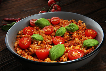 risotto with tomatoes, fresh herbs and parmesan cheese.