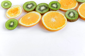 Fresh kiwi and orange sliced. Background for the profile, design, printing with fruit. The basis for the banner with orange and kiwi. Fresh and natkralnye vitamins. Healthy food. Flat lay, top view.