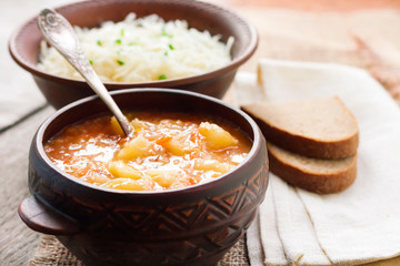 Kapustnyak - traditional Ukrainian winter soup with sauerkraut, millet and meat